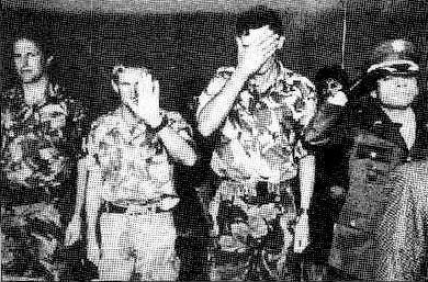 British military advisors embarrassed to be photographed at a passing out ceremony of an elite Colombian army unit, 1995. After Amnesty International
